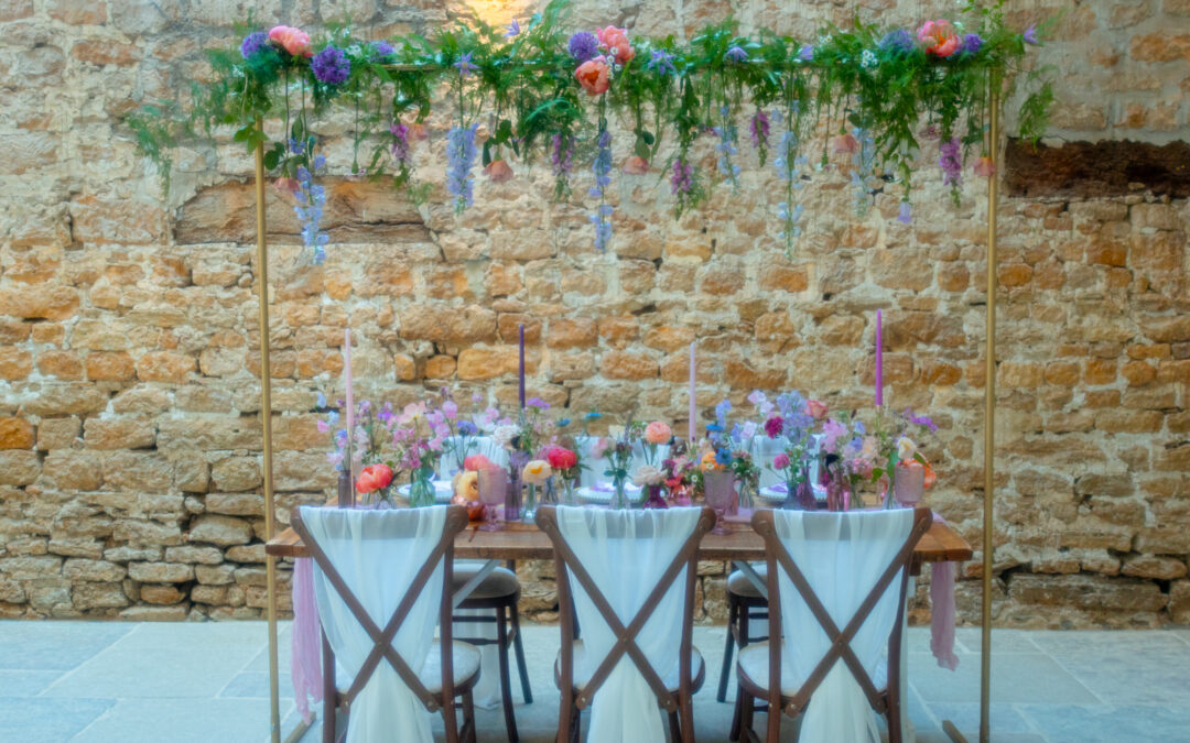 Elegant, playful and full of colour and texture – high summer table styling by Ambience Devon South at the stunning Symondbury Tithe Barn!