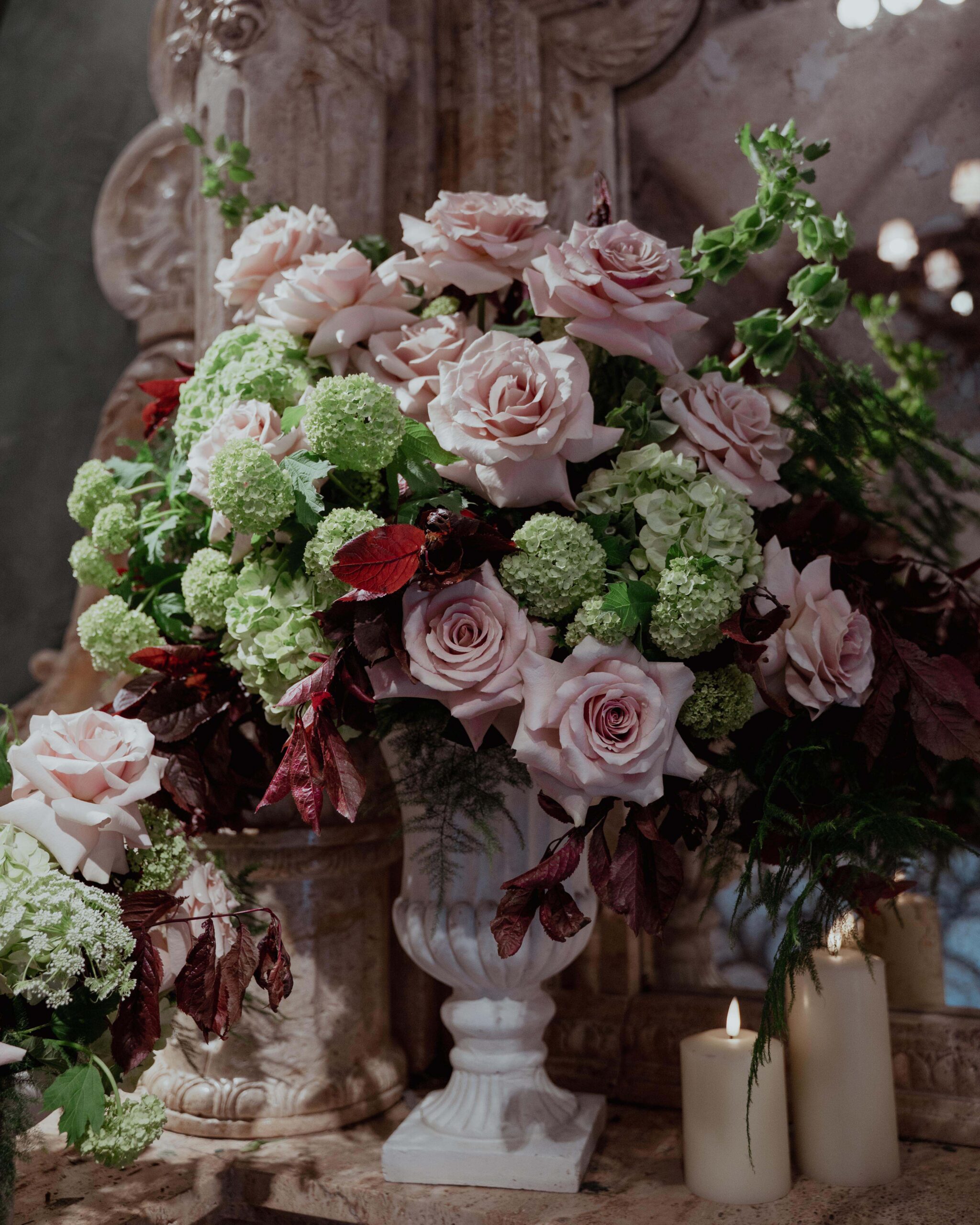 Ambience-Venue-Styling-Newcastle-Le-Petit-Chateau-Floral-Urns-Pinks-Green-Foliage-Candlelight-Aisle-Decor