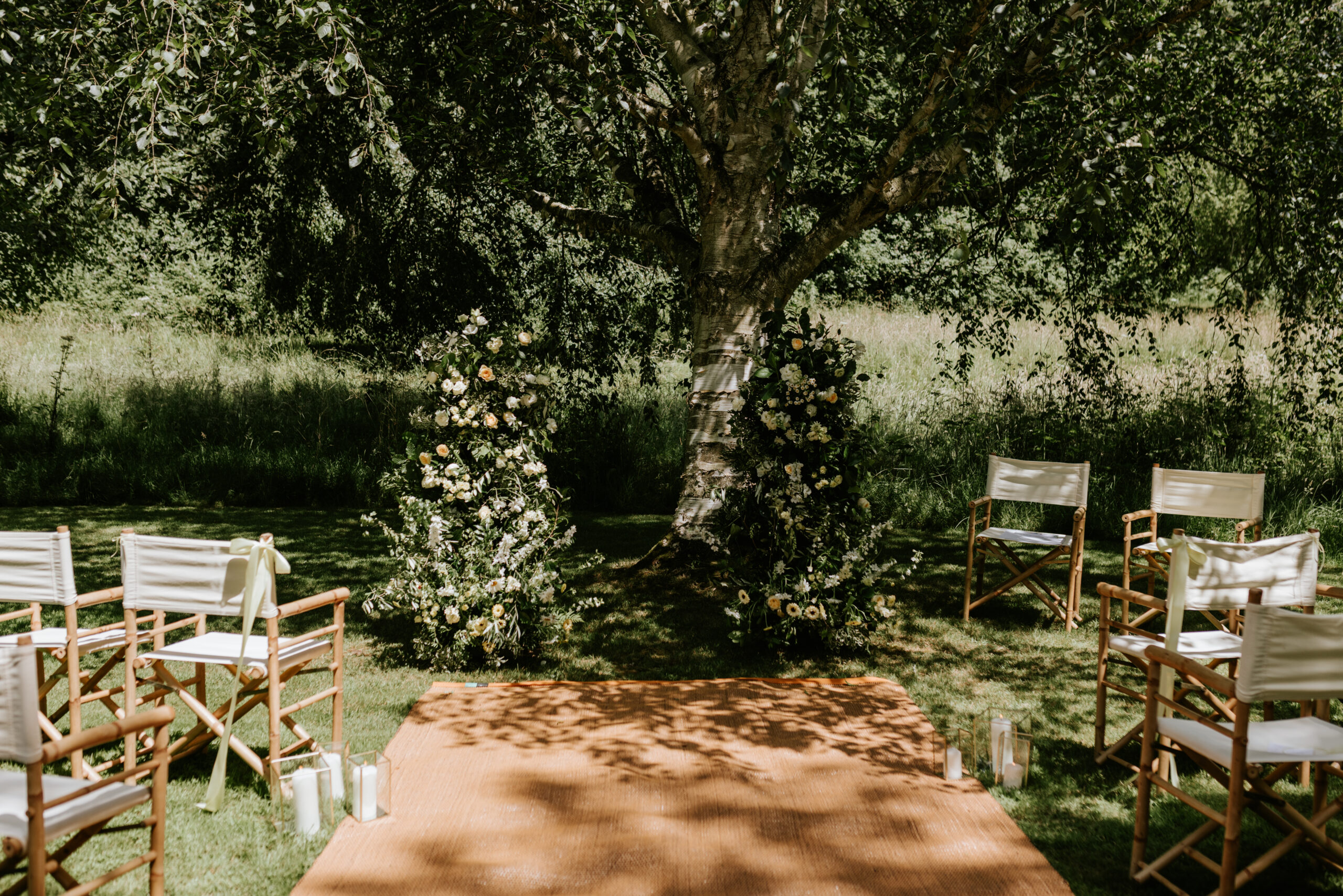 enue styling outdoor ceremonies with aisle runner, candlelight and bespoke floral installation